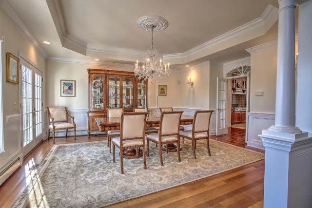 French doors lead to the gallery. Service is a breeze from the adjacent kitchen and the wet bar butlers pantry located in the gallery hallway.