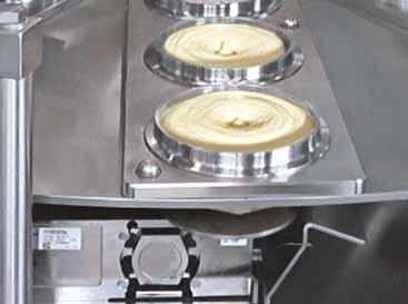 Inline weighing Cups are lifted and weighed by electronic weighing cells directly after the main filling station.