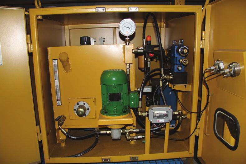 The lubrication unit (pictured below) is equipped with an oil pump, directional selector valves, pressure and temperature gauges, and an oil filter.