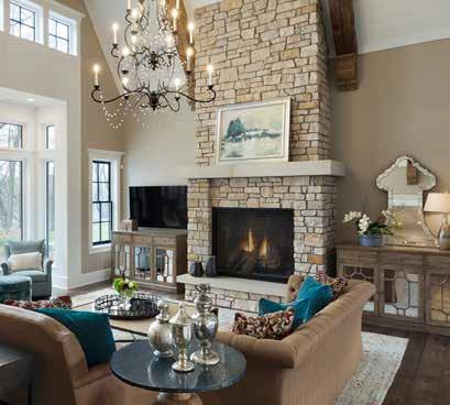 THE TRUE SERIES GREAT ROOM Elegant but inviting, the living room is a highlight of the home with its two-story vaulted ceiling covered in on-trend shiplap and exposed wood beams.