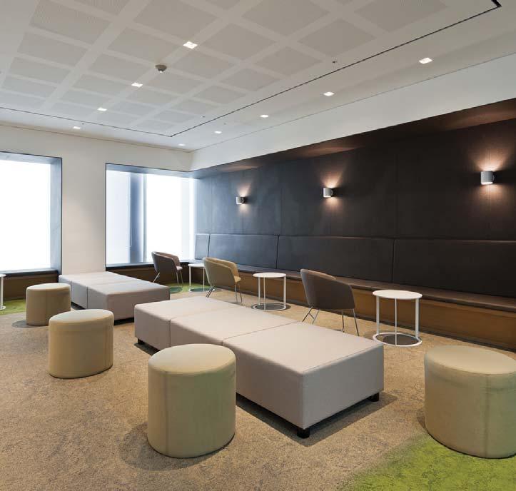 Throughout the space, wood is used to great effect creating a sense of warmth with fabric utilized as a point element both brightening up areas and presenting a cheerful working environment