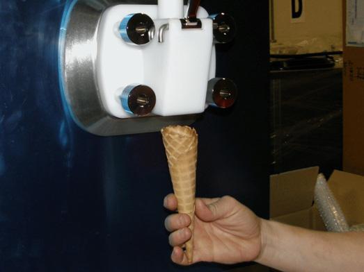 5 Operator Manual Chapter 5 - Operation 5.2 Dispensing soft ice cream 1. Hold an ice cream cup or cone under the ice cream dispensing spout. 2. Pull the ice cream handle down fully.