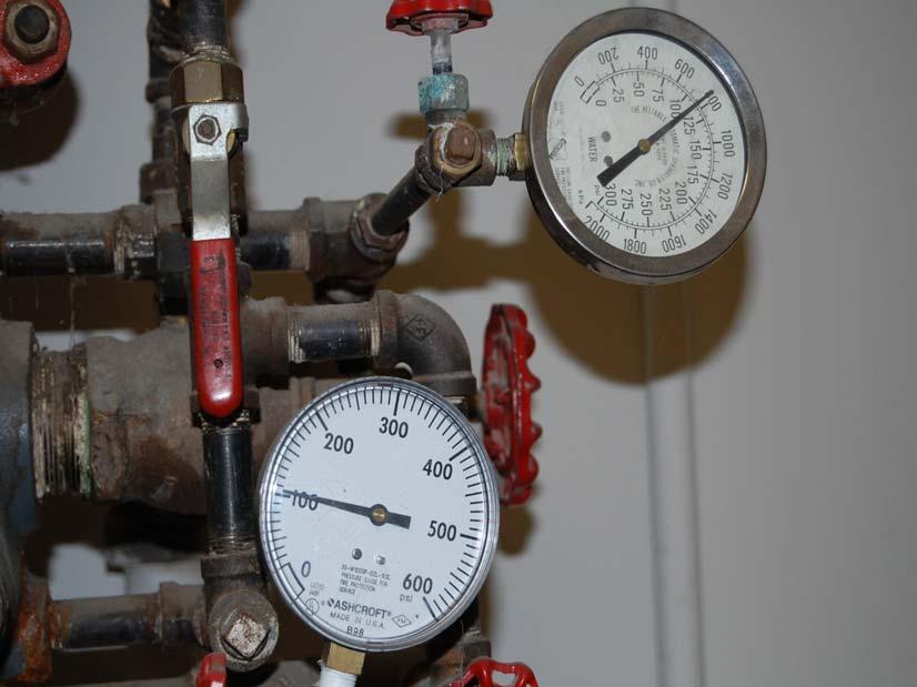 7.1.1.2 Pressure gauges shall be installed above and below each alarm check valve or system riser check valve where such devices are present. 2002 NFPA 13 