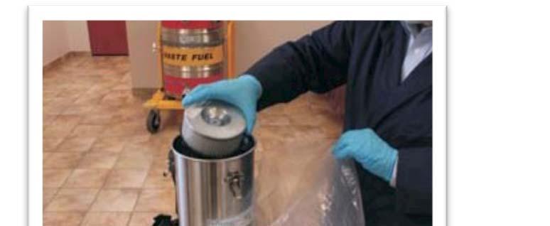 Prepare a poly liner and carefully remove the HEPA Filter from the Canister