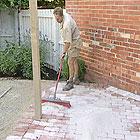 Materials Paving: Nigel created a rectangular entertaining area and limestone path using second-hand red house bricks.