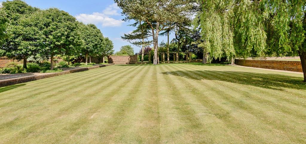 It is a traditional house constructed from handmade brick and tiles with Crittall windows and architecture heavily influenced by the celebrated design of Sir Edwin Lutyens Deanery Gardens in Sonning.
