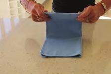 Place your whole hand on the cloth and wipe with even strokes. The cloth should be flat against the surface being cleaned.