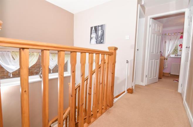 HALL, STAIRS, LANDING UPVC window, fitted under stairs office space, turned stair case leading to first floor, plastered and