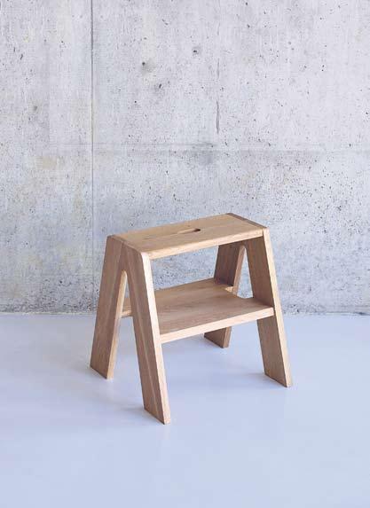 stool made from solid steel bar and an oak seat. The light or dark grey powder-coated tripod configured legs, have a low crossbar for foot support.