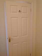 Bathroom - Continued 48 Doors White wood door with brass handle