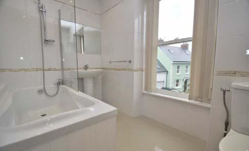 60m) Tiled flooring. Door to rear garden. Window to side. Hotpoint washing machine and tumble dryer. Recessed spotlights. Door through to: Separate WC 4'4 x 3'4 (1.32m x 1.02m) Tiled flooring.