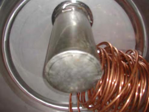 This smaller tank and the copper coil heat exchanger are shown in Figure 17. Figure 15. South facing windows in the basement of the house.