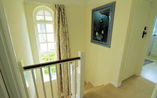 Landing Attractive timber balustrade and feature arched window to the side, doors to: Bedroom 1 14' x 12'2 (4.27m x 3.