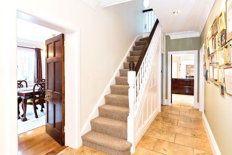 Hall Open staircase to first floor. Window to each side. Tiled and under floor heating. Door to cellar. Drawing Room Feature open fireplace with surround. Two windows to front and window to side.