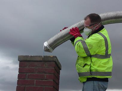 5) When the chimney liner is all the way through the flue, remove the nose cone and connect the base of the chimney