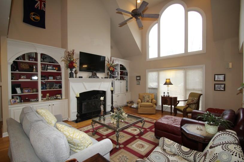 This home offers quality features including gleaming hardwood floors, cozy fireplace, crown molding, 4 bedrooms, smooth