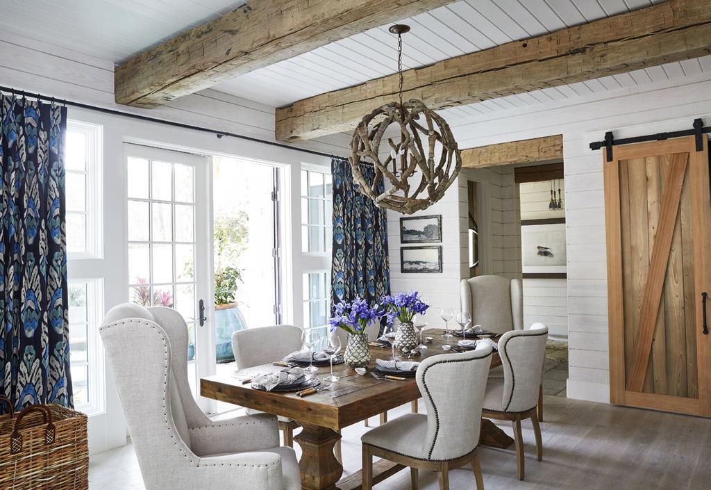 Above: The dining area features French doors that swing open onto the pool terrace.