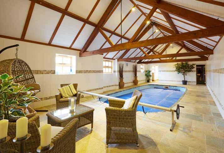 The west wing of the house which can be accessed by both the pool room and the garden, benefits from a useful boot room, gym, power room, and a 3 bay garage with automatic insulated roller shutter