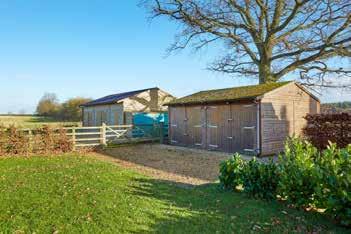 GARDENS AND GROUNDS Wood Farm Barn sits in a relatively secluded position with mature trees and hedges providing privacy.