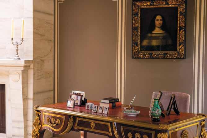 ornate French ormolu-inlaid desk in the living room provides a space for Carl Gouw to work