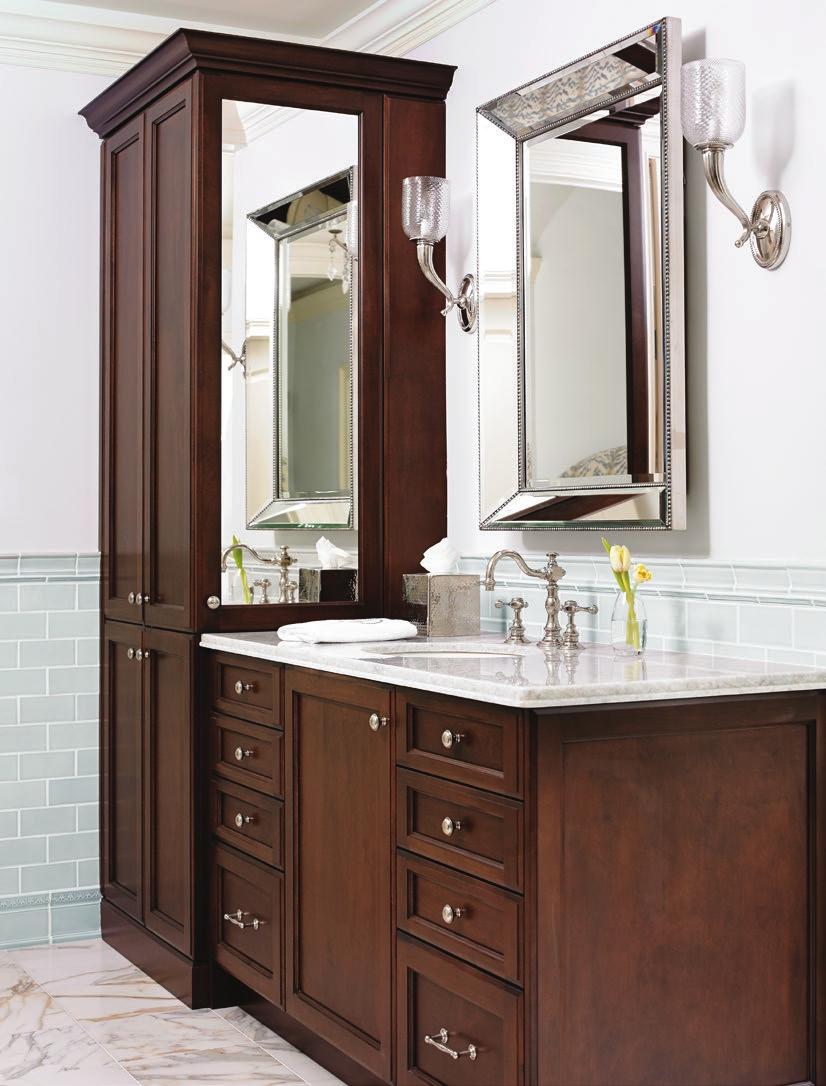 BELOW MIDDLE: John Downs side of the bath includes a place for linen storage in the left-hand cabinetry and a mirrored medicine cabinet. BELOW RIGHT: Shiny surfaces on the vanity reflect light.