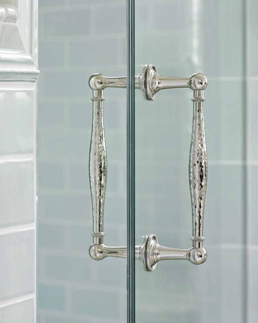 BELOW LEFT: Vintage-inspired shower fixtures in polished nickel pair perfectly with classic subway tile in a pale blue hue. BELOW MIDDLE: A separate water closet maintains privacy in the shared space.