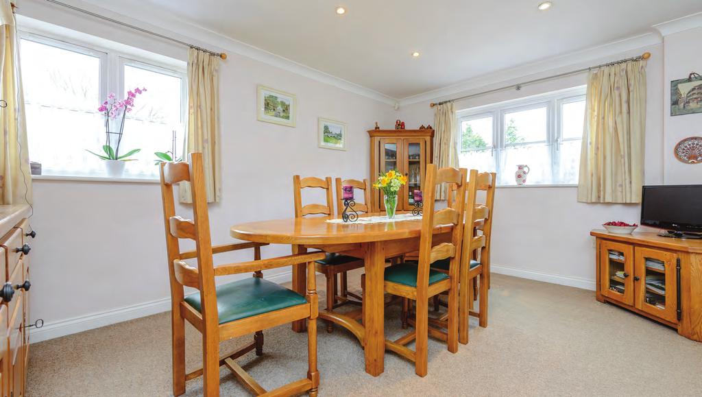 The kitchen/dining area is to the front of the property with double glazed windows to front and side aspects, a range of matching eye level and base units with work surfaces over, one and half bowl