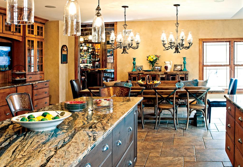 Painted walls brighten the kitchen and dining areas, which share a tile floor. The kitchen cabinets are all custom crafted.