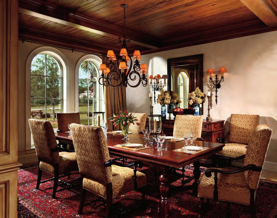 Pecky cypress decking is used on the dining room ceiling. Other elements, such as the arched windows and richly textured fabrics, underscore the Italian flavor of the interiors.