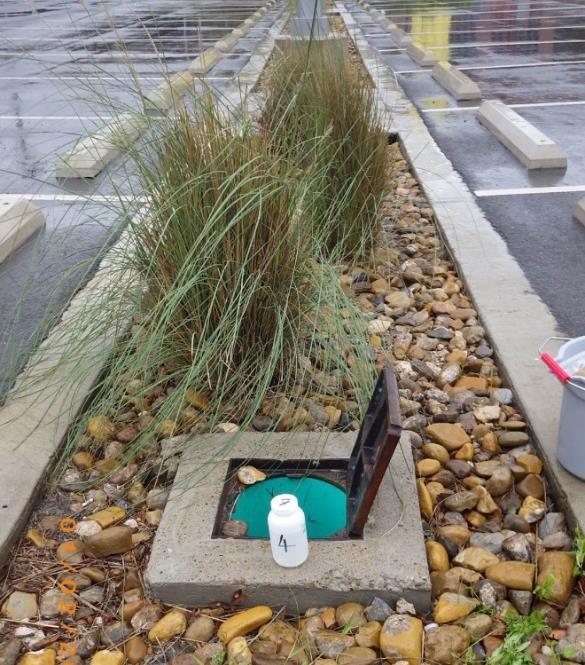 Fig. 3 Stormwater runoff sampling at the site 4 recycled crushed glass parking lot B.