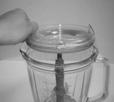 6 Line up the glass jar with safety/splash cover Place the power unit on top of the safety/splash cover and using your thumb and