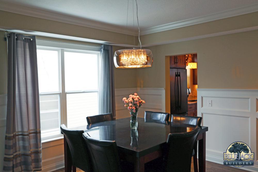 AFTER PHOTO: #5 This elegant, yet modern formal dining room features a dropped soffit wrapped