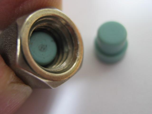 Verify the septum is inserted into the nut as shown.