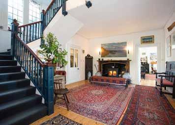 South facing and immensely private from both the road and water, this attractive Edwardian house is elevated above its stone quay and set behind generous, long-established gardens.
