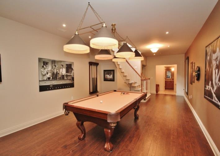 The Games Room: (42 x 19) offers 9ft ceilings, pot lights & quality engineered flooring.