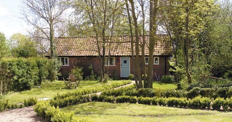 The property is located at the end of the long tree lined drive and has gardens of around one acre of established shrubs, knot garden, vegetable plot and trees