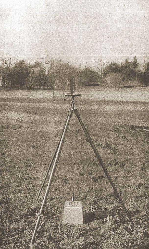 A surveyor s compass set up over a meridian monument in North Carolina. Coast and Geodetic Survey in 1900, describes one as being on the side of the hill above the Court-House.