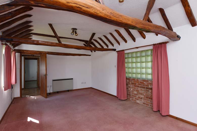 The Old Cartshed A part glazed wooden front door opens into the Entrance Hall With tiled flooring, exposed roof trusses and doors off to Sitting/Dining Room 21 x 12 3 (6.4m x 3.
