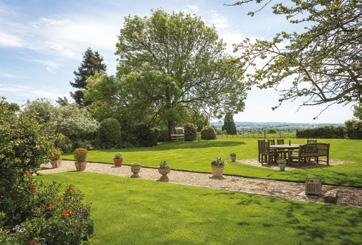The rear garden in particular has a great range of mature trees and shrub borders, well stocked with beautiful plants providing a variety of colour which enhances