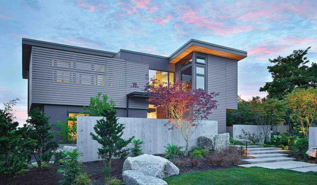 EXPANSIVE WINDOWS CAPTURE MOUNTAIN AND WATER VIEWS IN A GALLERY-LIKE SEATTLE HOME CREATED FOR AN ART-LOVING COUPLE.