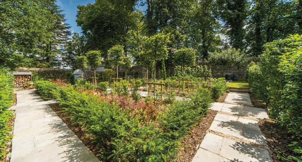 Gardens There are two primary areas of garden, a magnificently planted walled garden to the south and west of the house and a large partially wooded lawn surrounding the house to the