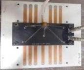 The heat load used in the experiment is provided by a heater block that was designed to represent a standard IGBT module size of 62 mm x 132 mm, Figure 1.