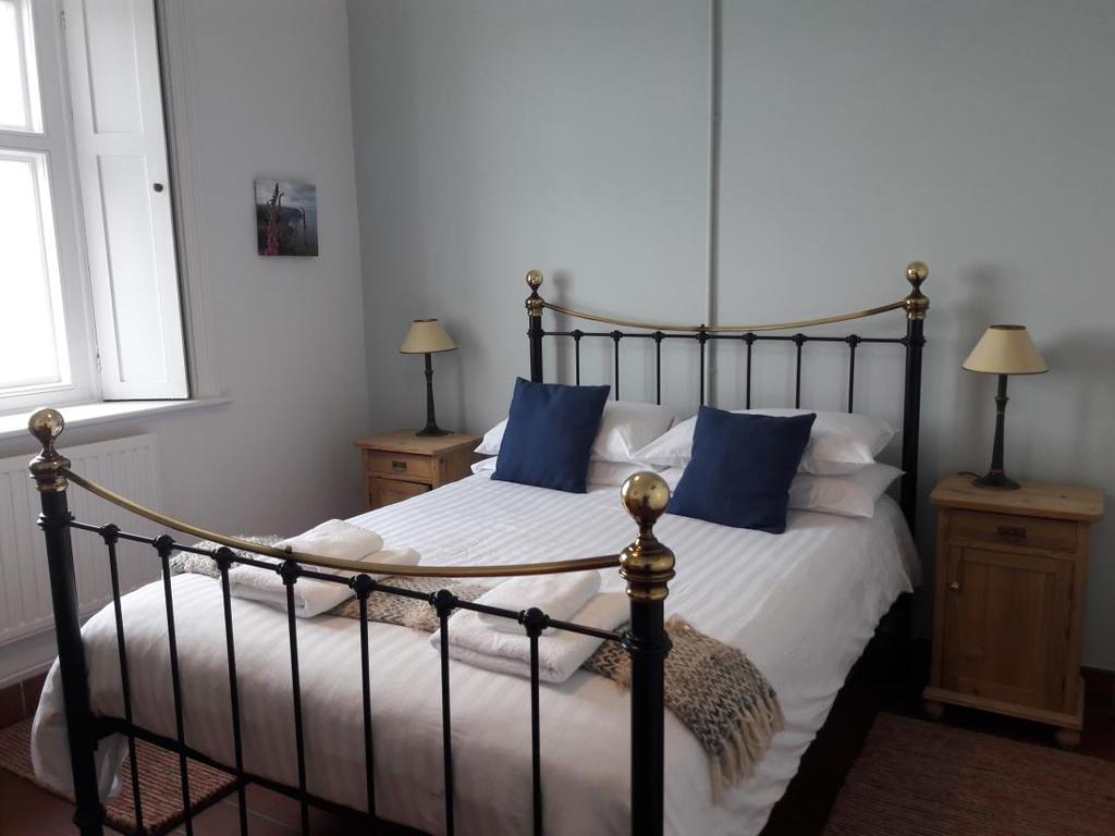 Double bedroom (Lynmouth Bay) - sea facing with a view of the Light 1 x 5 iron bedstead.