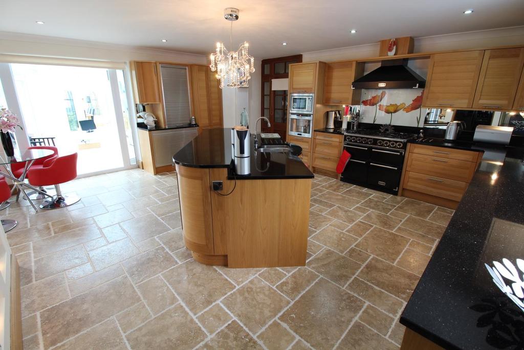 Page 5 Kitchen-Dining Area 5.60m x 5.00m This is a superbly fitted kitchen with a large range of Stoneham Oak units with inlaid stainless steel trims and black granite worktops.
