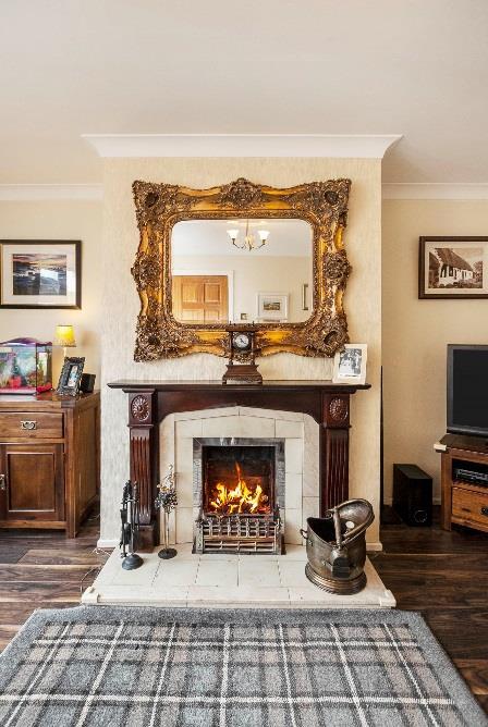 Hillsborough Castle Accommodation to include; Welcoming, homely entrance hall Living room with open fire and back boiler Open plan kitchen / dining room Three well proportioned bedrooms all with