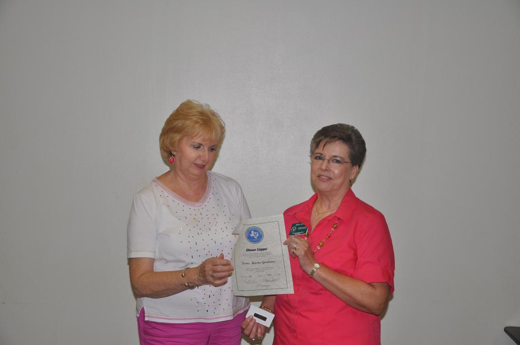 NEWLY CERTIFIED MASTER GARDENER Diane Lippe was recognized as being a newly certified Master Gardener; she received her certificate, name badge, and membership card from President Peggy Jones at the