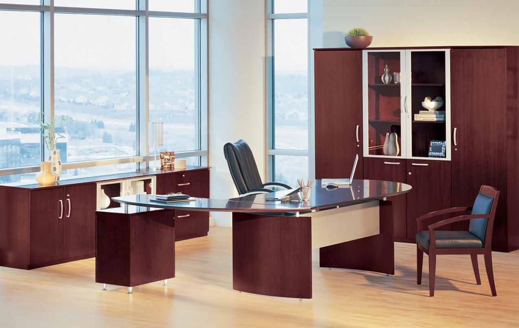 Curved desk surfaces merge together to define your space with elegance and efficiency.