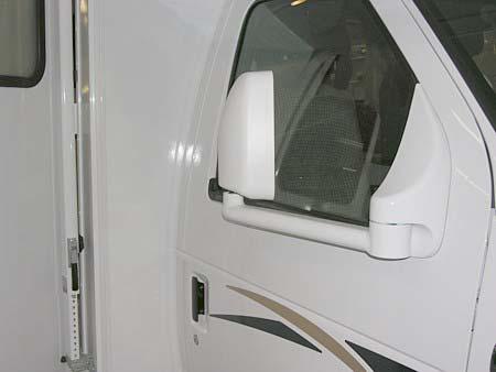 SECTION 3 DRIVING YOUR MOTOR HOME Mirror Heat Switch Mirror Adjustment Control Mirror surface tilts in direction of arrow button pressed. Middle switch selects L or R mirror to adjust.