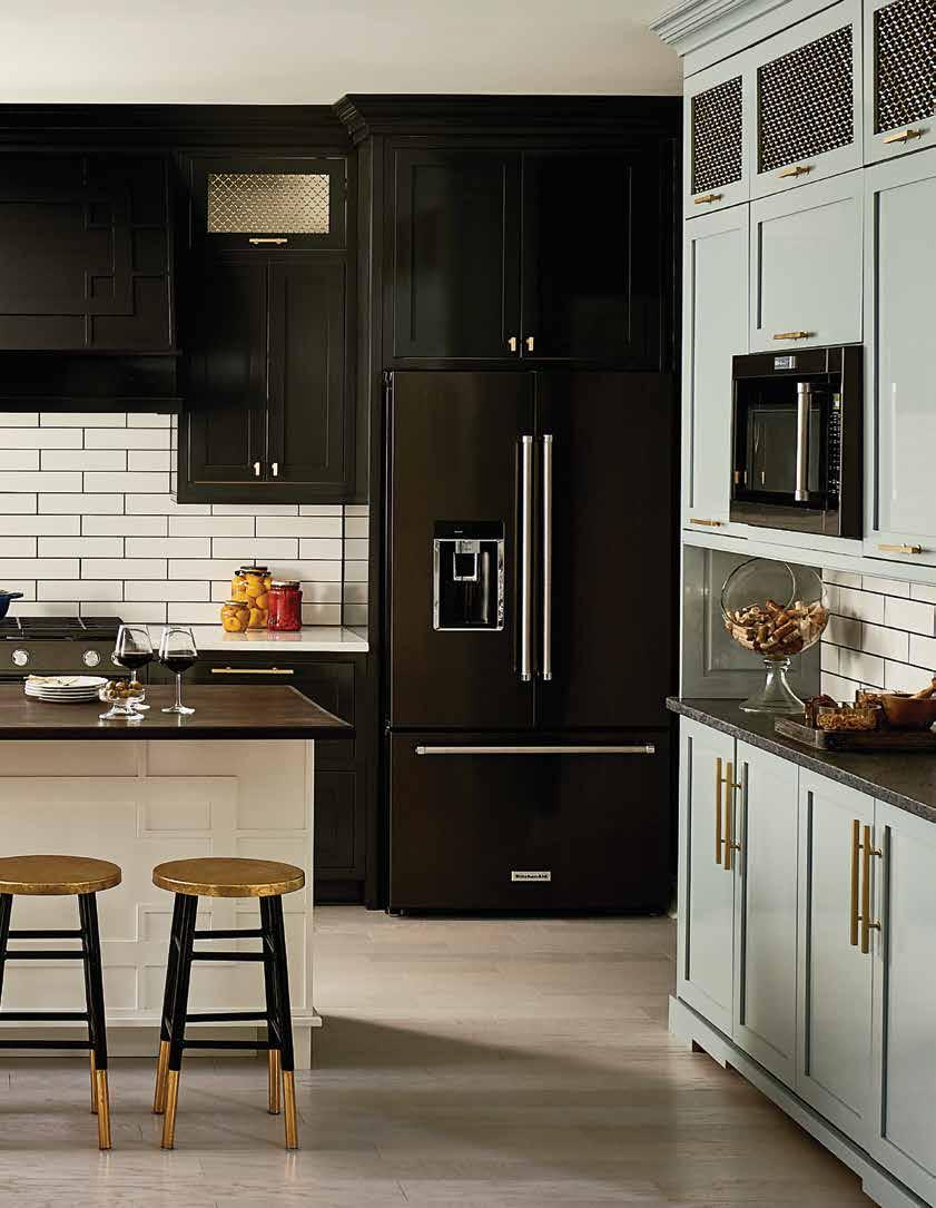 Classic with atwist Gold accents sparkle like jewelry in interior designer Jessica Dauray s confident black kitchen.