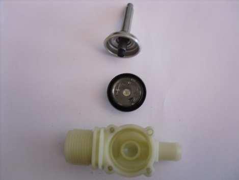 Press on the solenoid coil and rotate to release it from its support; remove it from the solenoid valve.